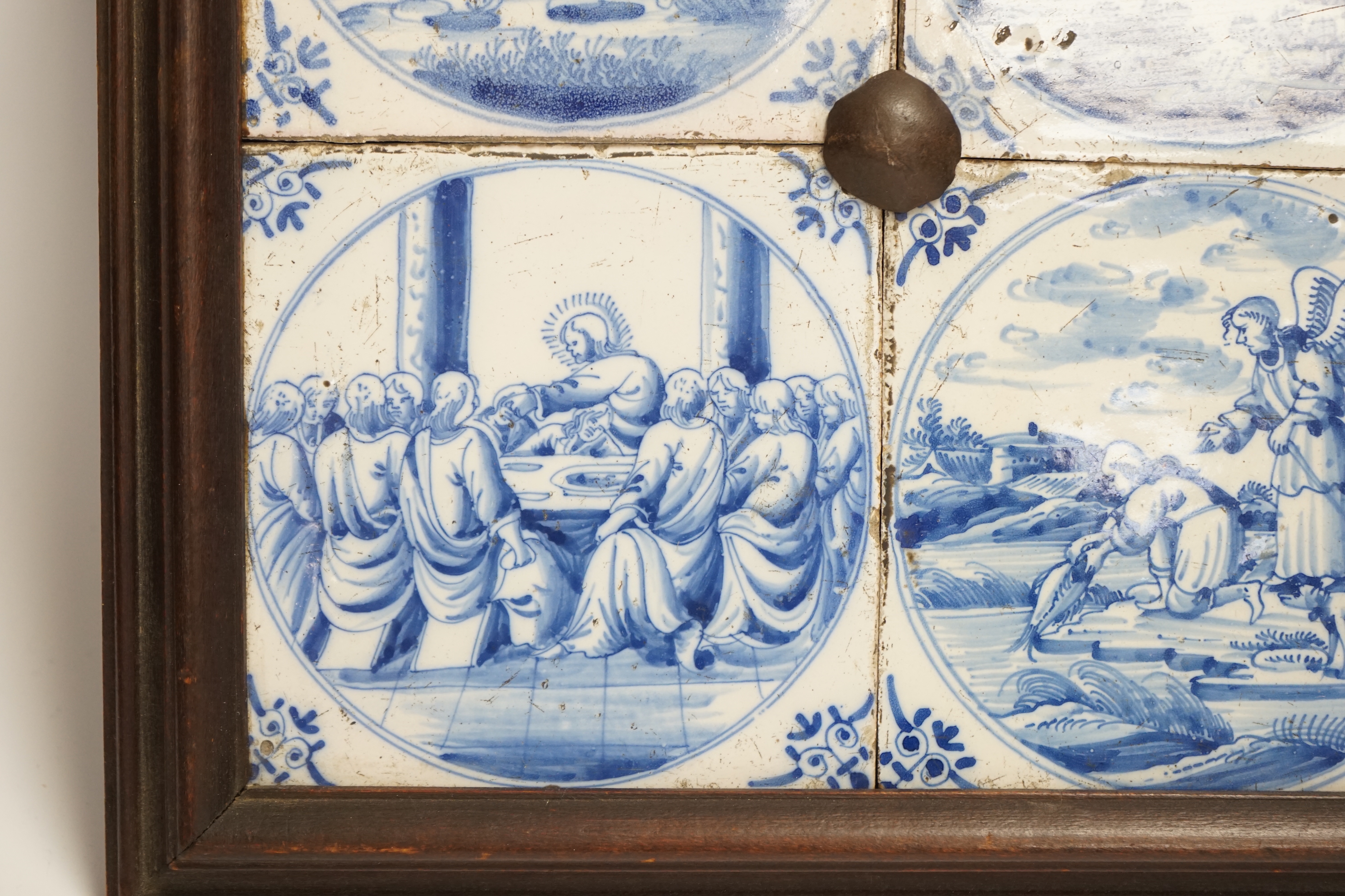 Four framed 19th century Delft ‘bible story’ tiles, 31cm x 31cm